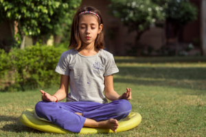 A child in lotus pose