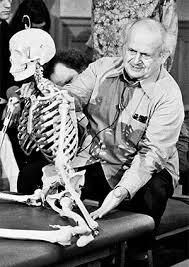 Moche Feldenkrais demonstrating on a skeleton. 