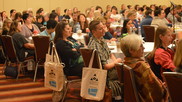 Delegates at the annual national conference watching the keynote speech by Tommy Europe