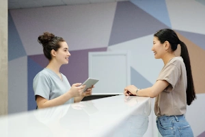 A client at the counter of a clinic