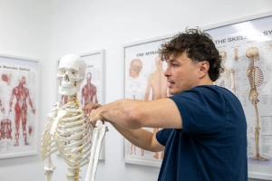 Dryden Benoit manipulating a model skeleton