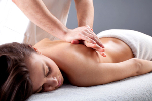 A woman receiving a massage therapy treatment.