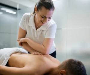 A massage therapist working on a client's back.