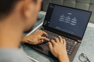 A person using AI on a laptop