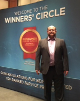 Pete Swales standing beside Consumers Choice Award