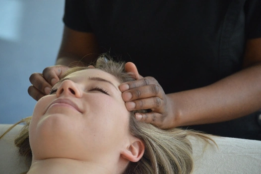 A practitioner working on a client's neck