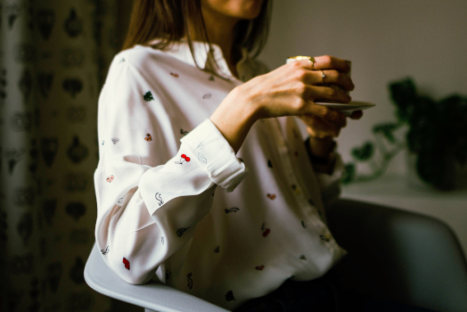 A woman relaxing with a cup of tea.