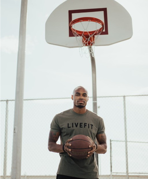 Trevor Jordan holding a basketball. 