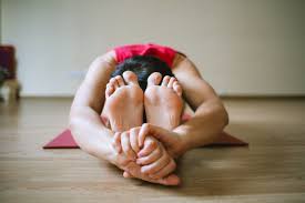 Yoga practitioner in a forward fold pose