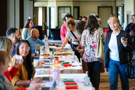 Staff at table interacting with members